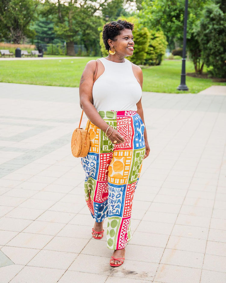 Georgette wears print pants and a white top | 40plusstyle.com