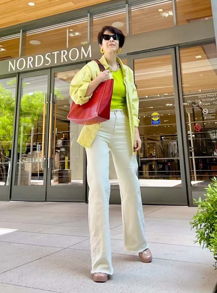 Natalia wears a lime top and white jeans | 40plusstyle.com
