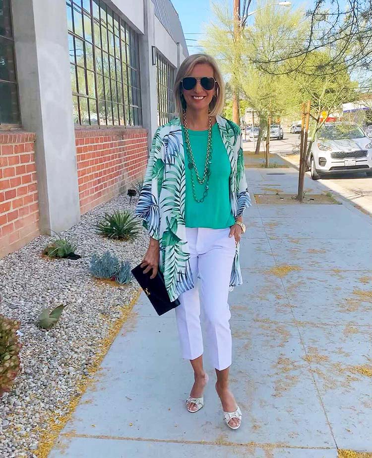 Nora wears a green and white summer outfit | 40plusstyle.com