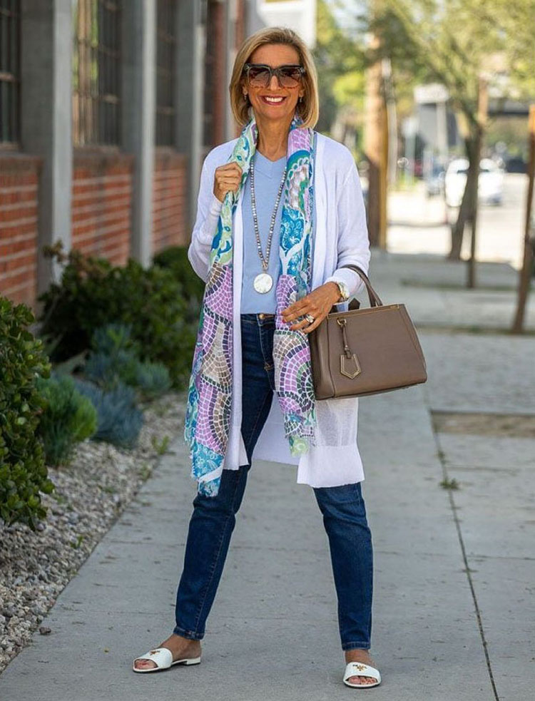 Nora wears a white cardigan and print scarf | 40plusstyle.com
