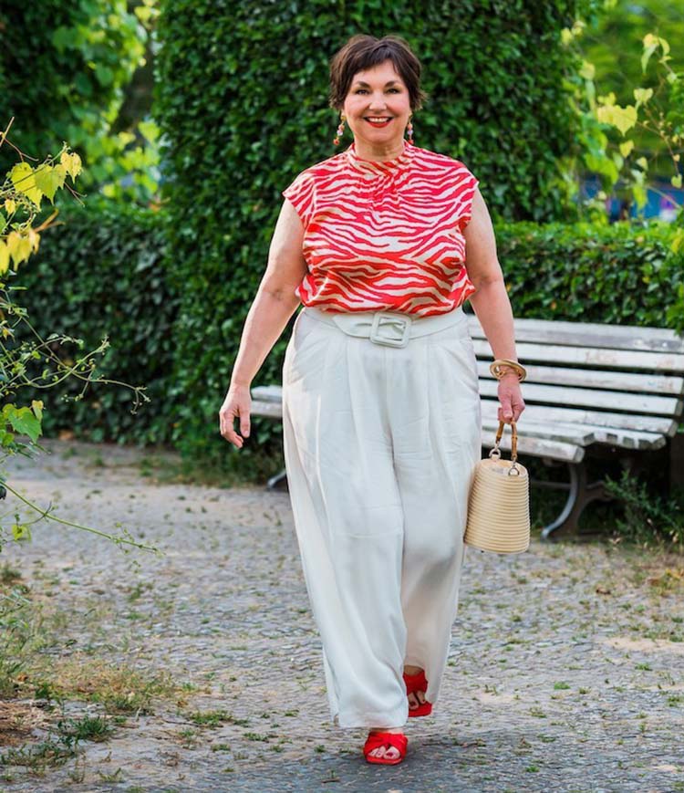 Spring color palette - Susanne wears a red and cream outfit  | 40plusstyle.com