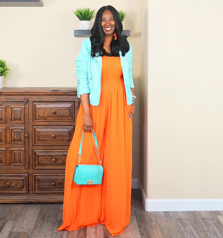 Tanasha wears a vibrant orange outfit | 40plusstyle.com