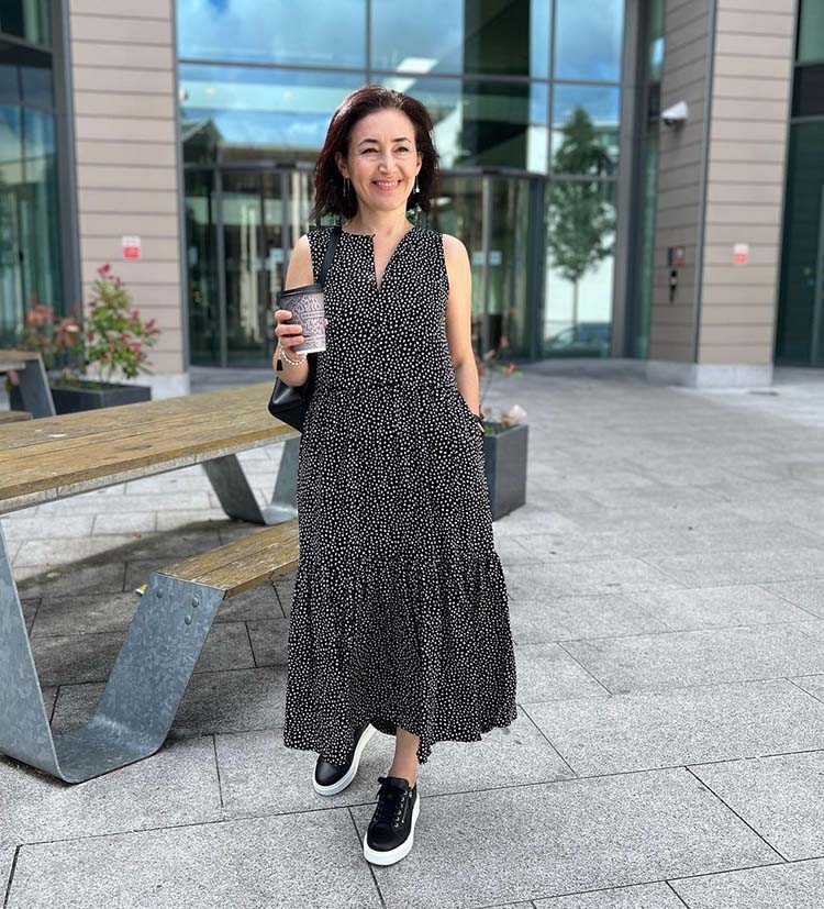 Emms wears a maxi dress and sneakers | 40plusstyle.com