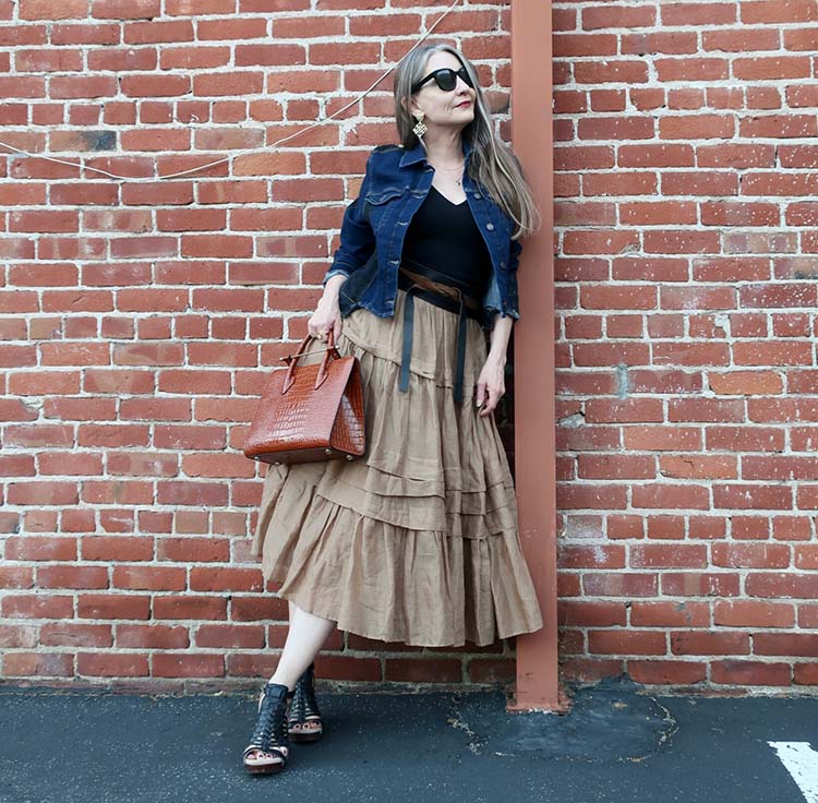 Dawn Lucy in denim jacket, tiered skirt and caged sandals | 40plusstyle.com