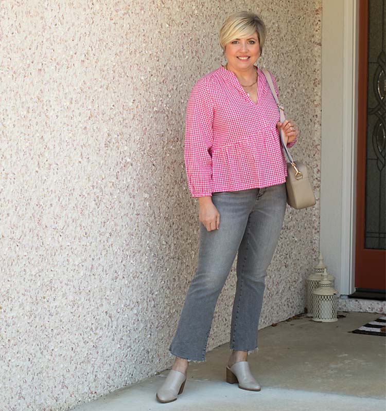 Fonda in peplum top, cropped jeans and mules | 40plusstyle.com