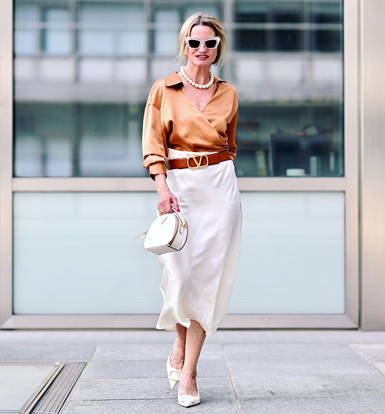 Yvonne wears a bronze top and cream skirt | 40plusstyle.com