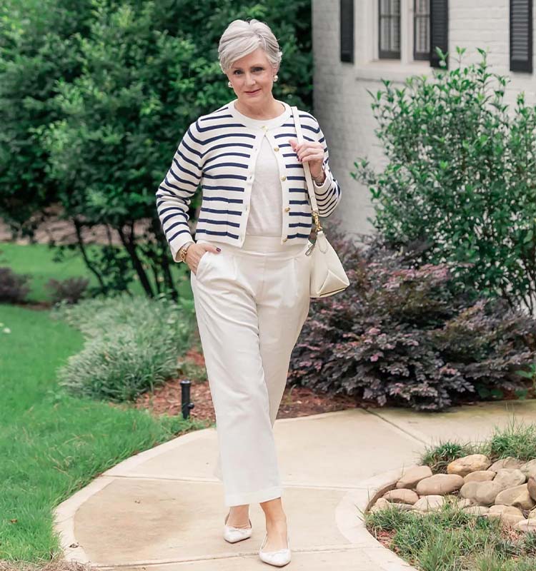Beth wears a striped jacket and white pants | 40plusstyle.com