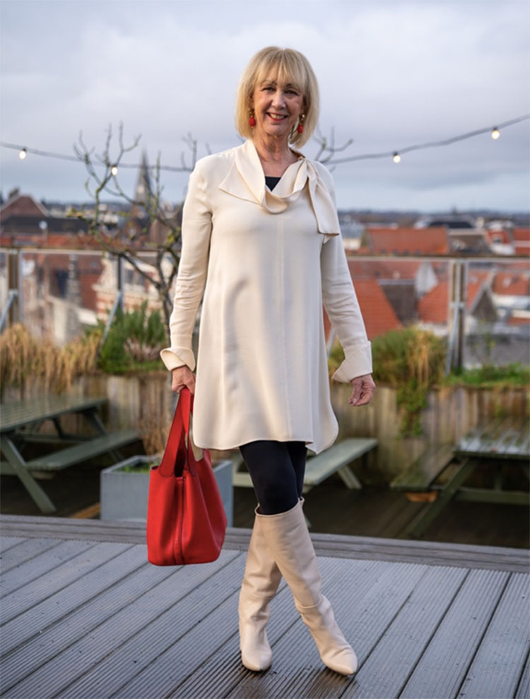 Dresses to wear sweaters with - Greetje matches her dress to her boots | 40plusstyle.com