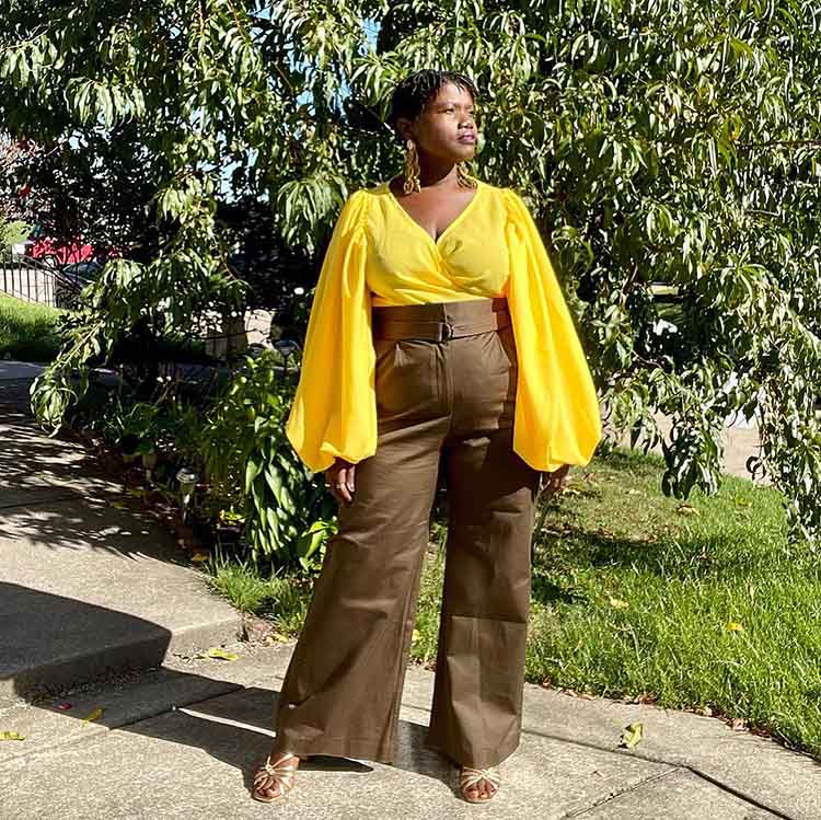 Tops to hide a tummy - Georgette wears a yellow top | 40plusstyle.com