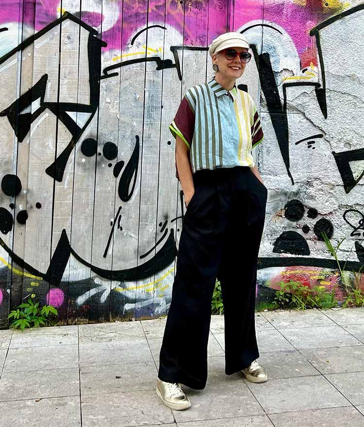 Sylvia in a striped shirt and black pants | 40plusstyle.com