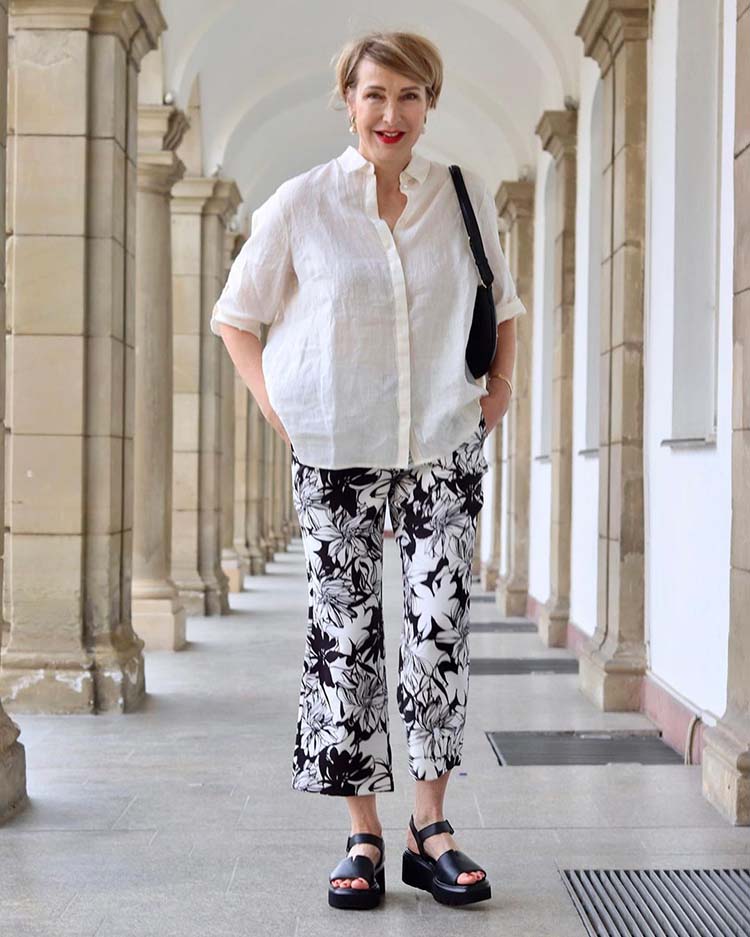 Summer tops - Claudia wears a linen shirt and print pants | 40plusstyle.com