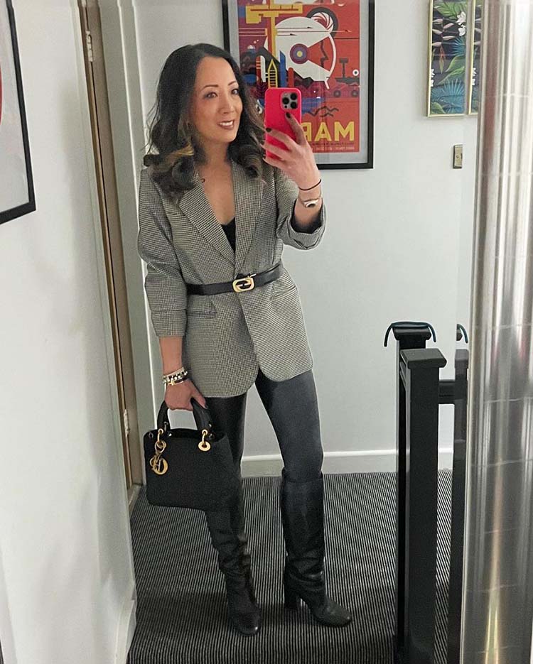 Abi wearing a blazer with with leather leggings and high boots | 40plusstyle.com