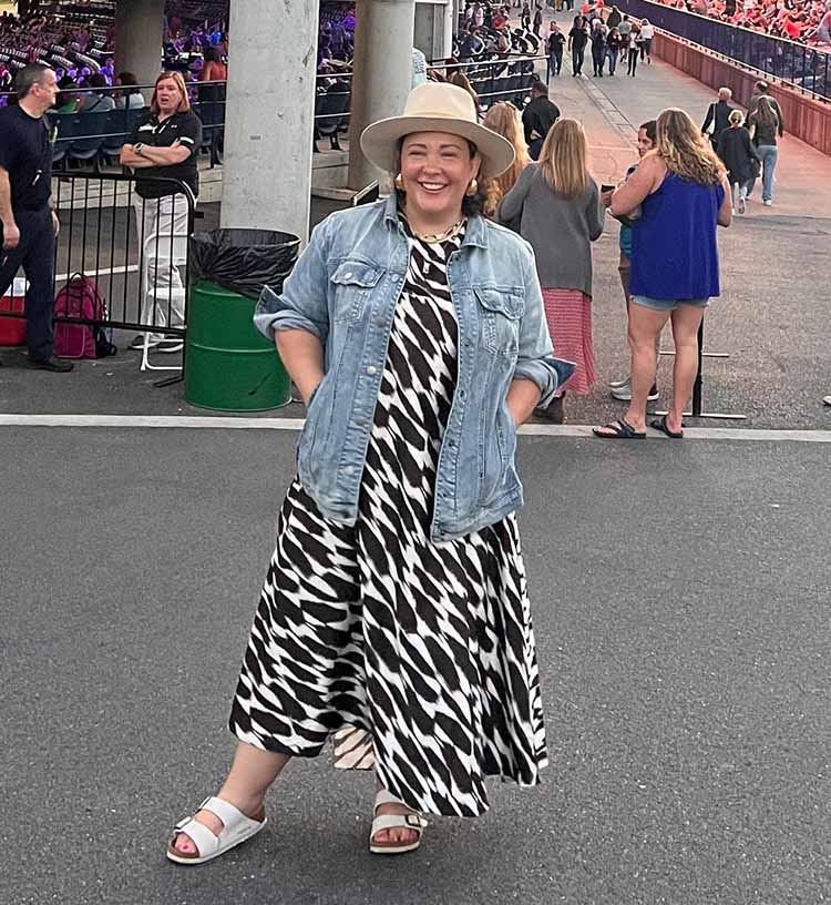 Alison wears a denim jacket with a summer dress | 40plusstyle.com