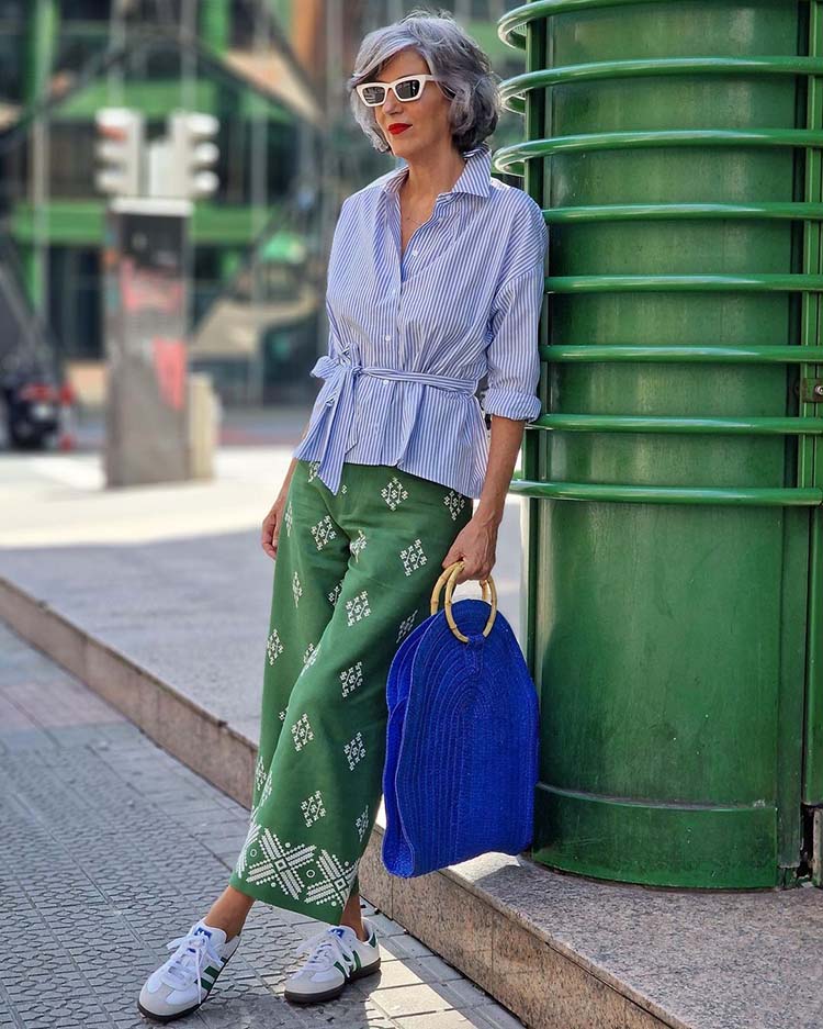 Carmen wears a striped top and print pants | 40plusstyle.com