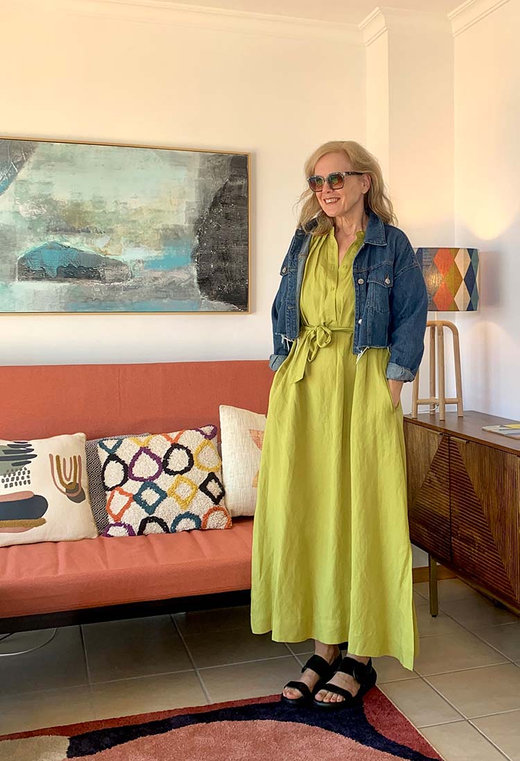 Sylvia wears a green dress and blue jacket | 40plusstyle.com