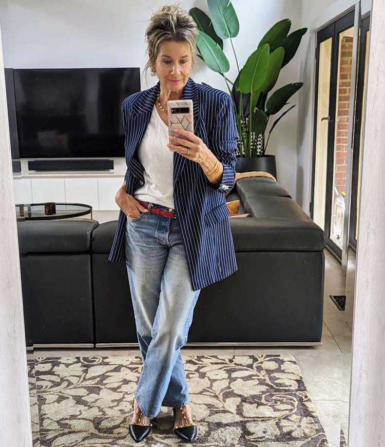 Suzie in pinstripe blazer, straight jeans and heels | 40plusstyle.com