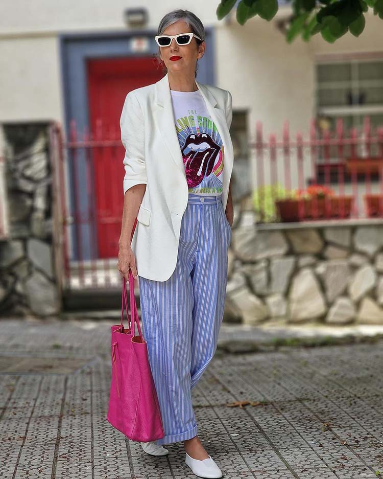 Carmen wears a ruched sleeve blazer and striped pants | 40plusstyle.com