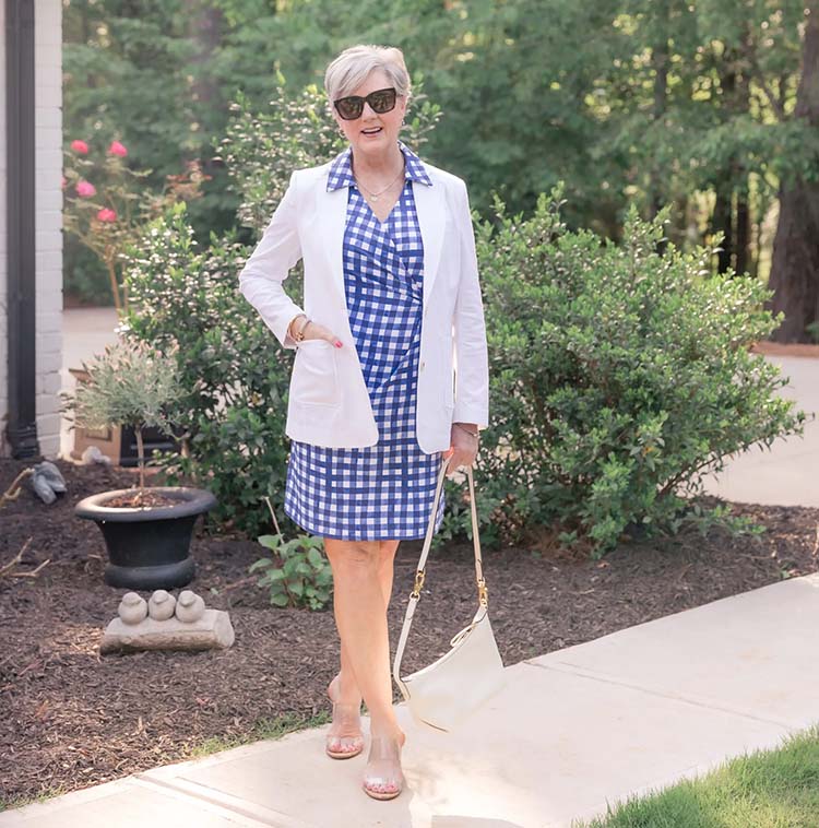 Beth wears a white jacket with her gingham dress | 40plusstyles.com