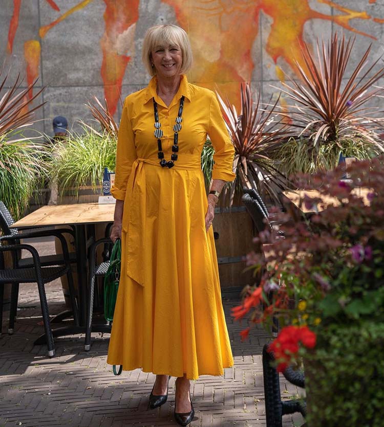 Dresses for the fall - Greetje in a yellow wrap dress | 40plusstyle.com