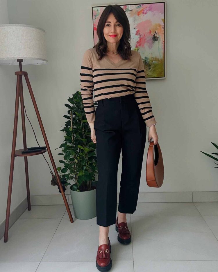 Nicola wears a stripe top and tassel loafers