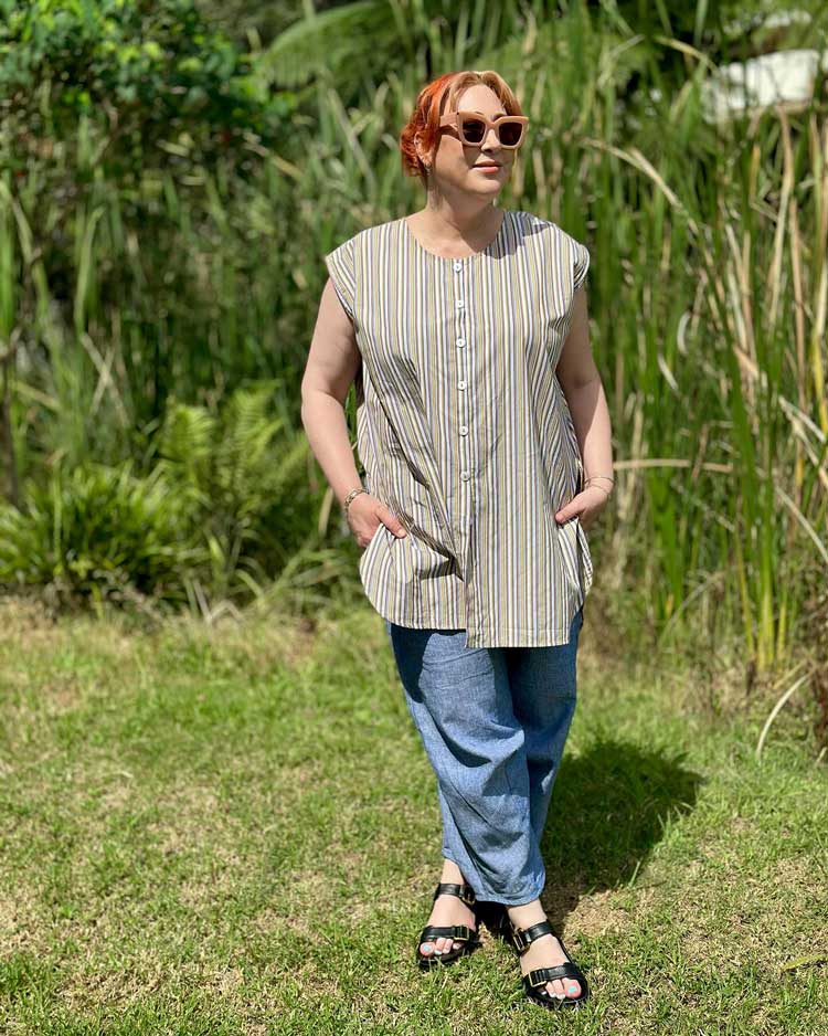 Kimba wears a striped top and lightweight pants | 40plusstyle.com