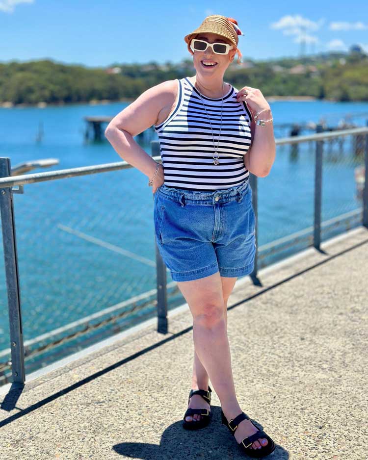 Kimba wears denim shorts and a striped top | 40plusstyle.com