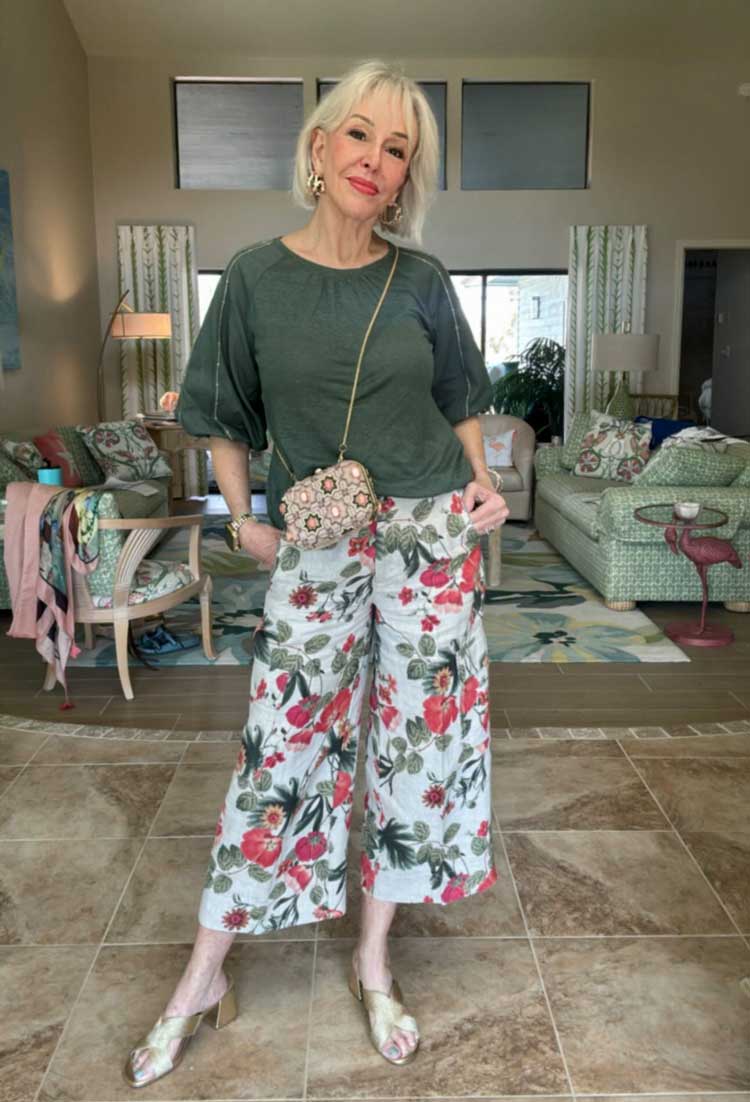 Sheree wears floral pants and a green top | 40plusstyle.com