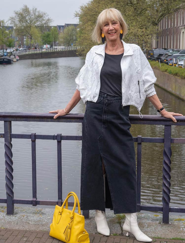 How to wear denim for fall - Greetje in a maxi skirt and white boots | 40plusstyle.com