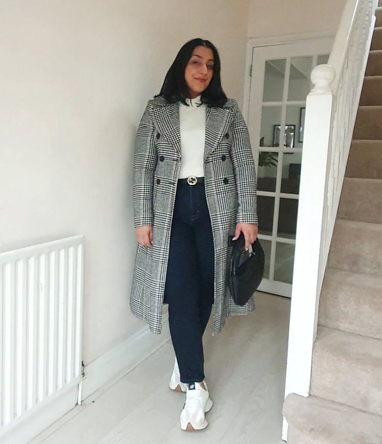 Jas wears a plaid coat and sneakers | 40plusstyle.com