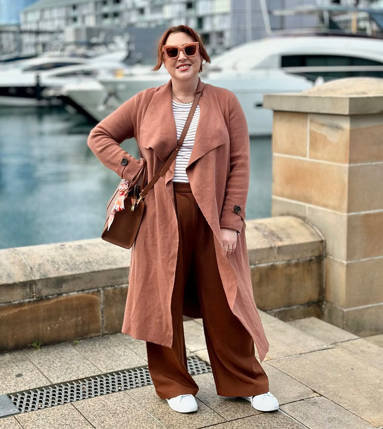 Kim wears brown pants and white sneakers | 40plusstyle.com