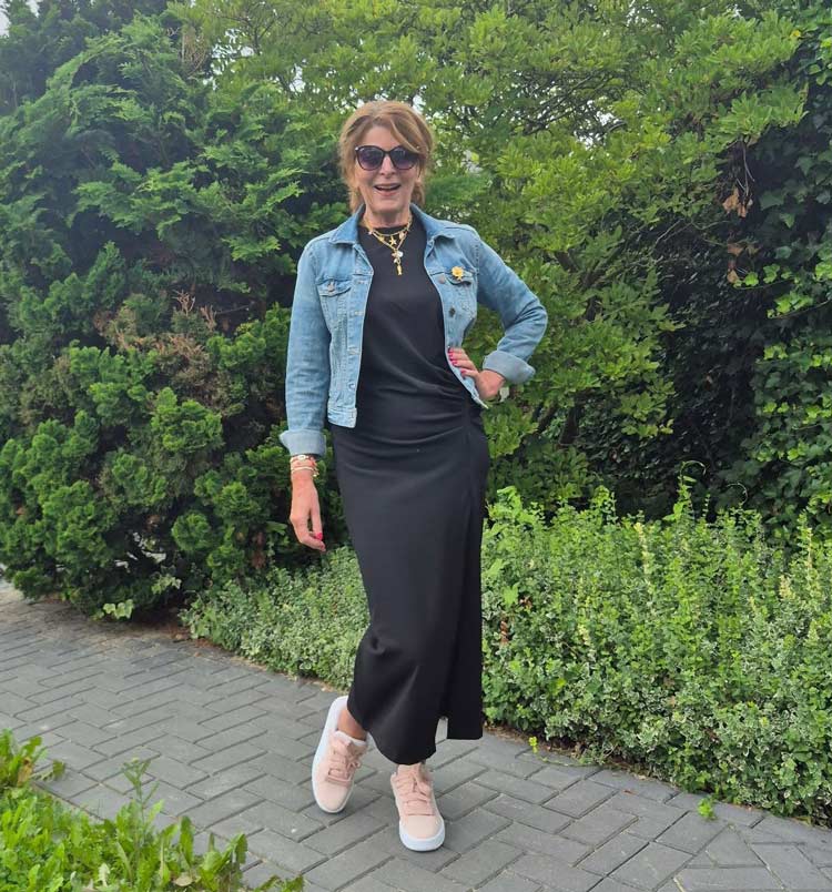 Nancy wears a denim jacket and black dress | 40plusstyle.com