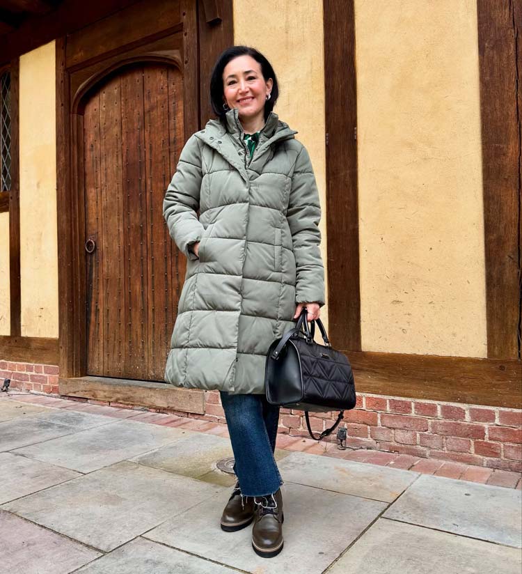 Emms wears a puffer coat and jeans | 40plusstyle.com