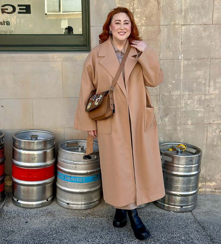 Kimba wears a camel coat | 40plusstyle.com