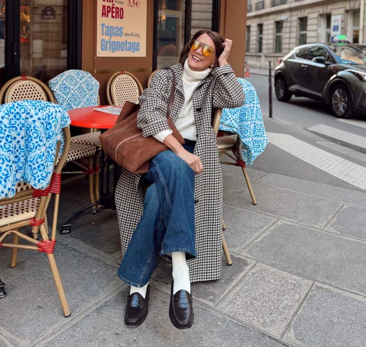 Sylvia wears a plaid coat and jeans | 40plusstyle.com