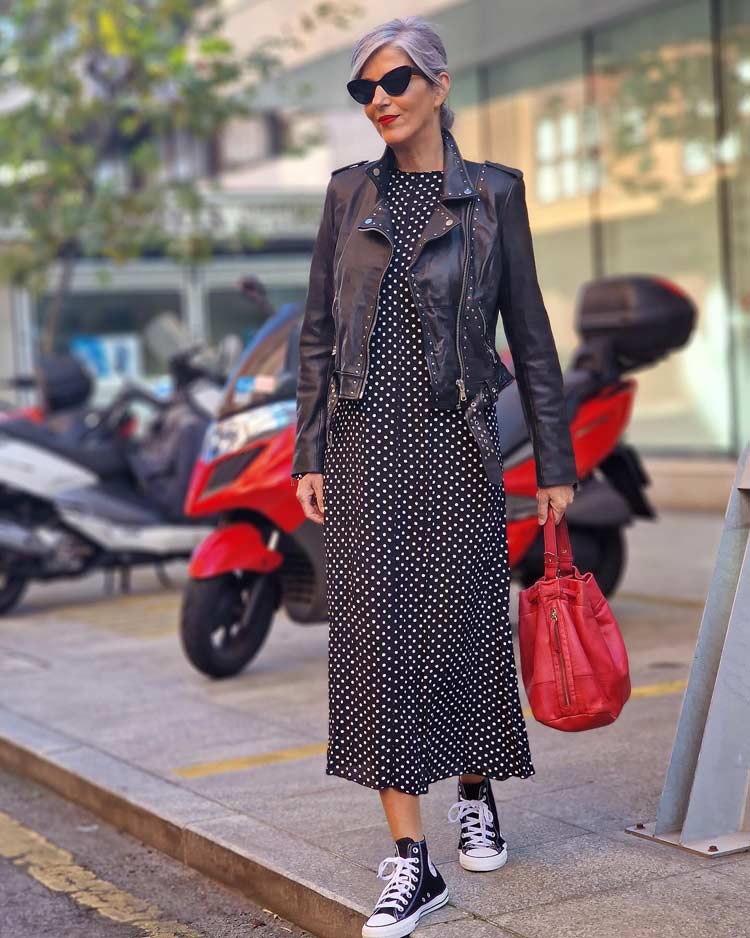 Carmen wears a polka dot dress and leather jacket | 40plusstyle.com